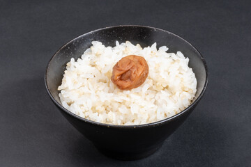 A Japanese salted plum on brown rice, Food or culture background, Nobody