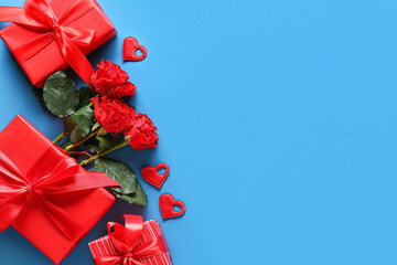 Gifts for Valentine's Day and rose flowers on blue background