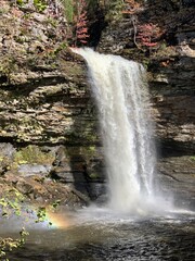 Large waterfall off rocky ledge