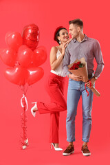 Happy young couple with bouquet of flowers and balloons on color background. Valentine's Day celebration - obrazy, fototapety, plakaty