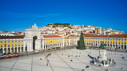 Lisbon, Portugal - January 13, 2022: Aerial drone view of the Augusta Street Arch from Commerce Square in Lisbon, Portugal. Christmas tree in the plaza.