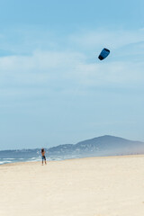 Young Man Practicing Kitesurfing on a Beach in Noosa,Queensland,Australia
