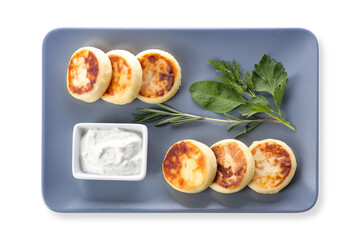 Plate with tasty cottage cheese pancakes and sauce on white background