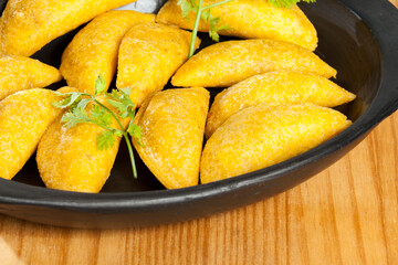 Delicious empanadas, Colombian cuisine. on the wooden table