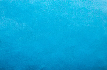 Background image of pillows made of bright colored synthetic fabrics.