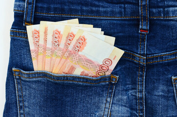 5000 russian rubles, money banknotes in the pocket of jeans, concept of salary, savings, pocket money, investments, income
