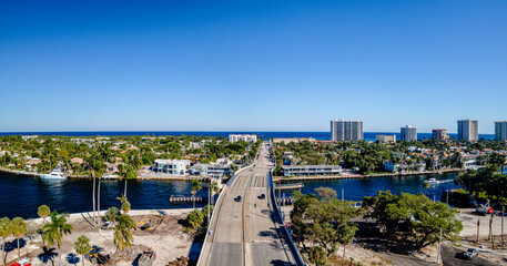 Fototapeta premium panoramic aerial drone view of bridge and city in Boca Raton, Florida with traffic 