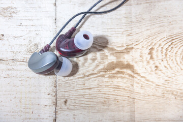 Headphones on wooden floors, technology, stereo 7.1 technology, hybrid sound system, 3965 bitrates, on wooden floors, technology