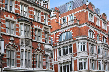 Fototapeta na wymiar Elegant old apartment buildings with ornate detailing