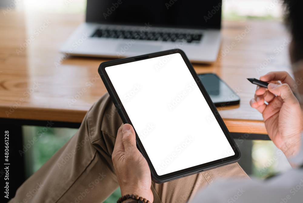 Poster close up view of man using tablet blank white screen for text message or information.