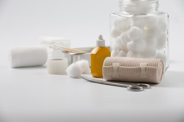 Bandage and first aid kit on white background...