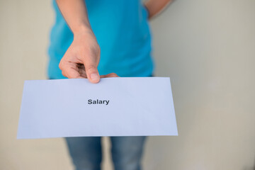Employees wearing a blue shirt pay a salary, bonus.