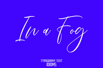 In a Fog Stylish Hand Written Alphabetical Text idiom on Blue Background