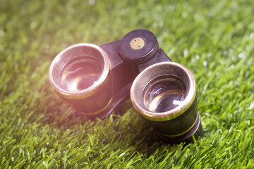 Theatrical binoculars in the grass