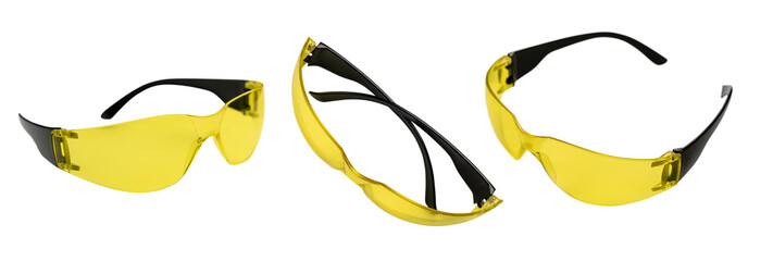 Yellow safety glasses in different angles on a white background