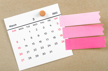 March 2022 calendar with blank adhesive note paper.