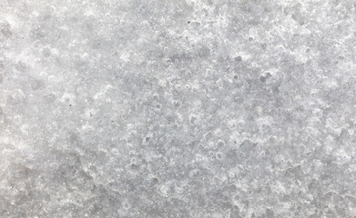 Dirty snow on nature as a background.