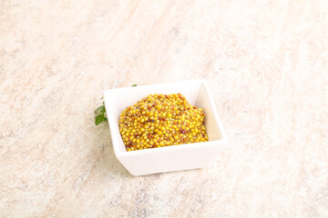 Grain mustard sauce in the bowl