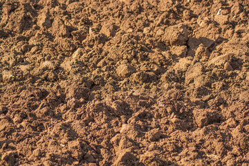 Mud texture or brown soil as natural organic clay and geological sediment mixture as in roughing