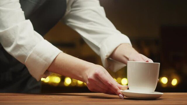 Buying coffee or tea and paying by cash close-up. Shopping in restaurant or cafe.