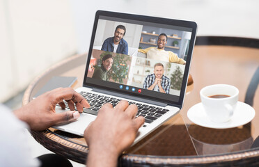 Remote Communication. Unrecognizable Black Man With Laptop In Cafe Having Video Conference