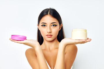 portrait pretty woman in a white jersey jar with cosmetics studio model unaltered