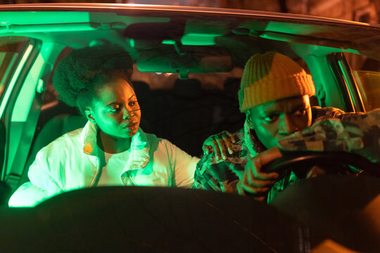 Young woman try to help friend or husband with mental problem, financial troubles at work or relive anxiety. African american couple after fight in car. Sad depressed man and guilty girl feel sorry