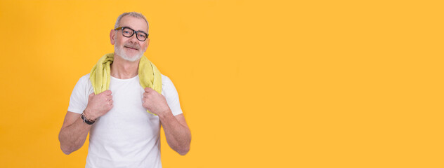 middle-aged athletic man with towel around neck