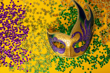 Mardi Gras Luxury Masquerade venitian festival carnival mask, gold color beads and golden, green,...