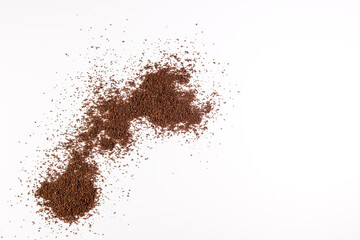 Fototapeta na wymiar Coffee grains spilled on white background. Color version