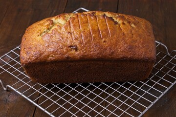 Freshly baked banana bread on cooling rack - Powered by Adobe