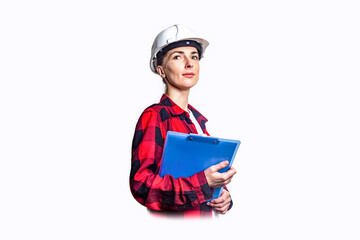 Young woman in construction clothes with clipboard on light background.