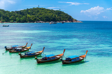 Obraz na płótnie Canvas Beautiful Andaman sea, Tropical Turquoise clear blue sea and white sand beach on pattaya beach with blue sky background at Lipe Island, Satun, Thailand - summer vacation travel