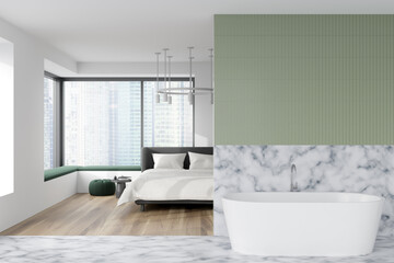 Light bedroom interior with bathtub and bed near panoramic window. Empty wall