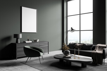 Dark living room interior with couch and coffee table, commode and mockup poster