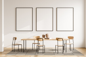 Light guest room interior with chairs and table, mockup posters