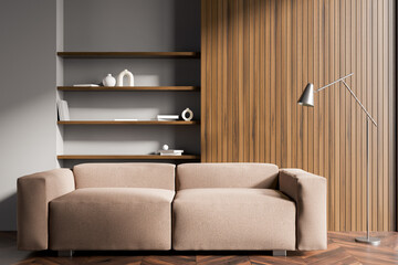 Dark living room interior with sofa, shelves with books, crockery