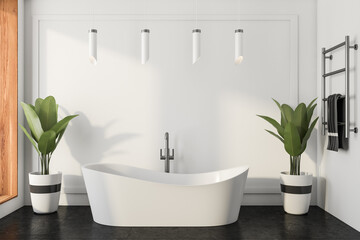 Naklejka na ściany i meble Light bathroom interior with bathtub on tile floor, towel and ladder