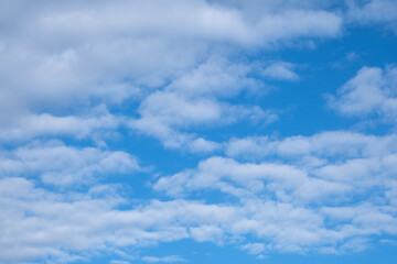 blue sky and white stratocumulus clouds.