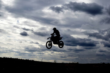 Obraz na płótnie Canvas motorcyclist on a motorcycle in the air