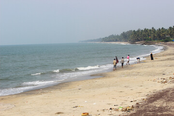 people walking on the beach