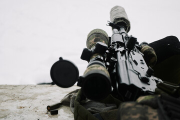 Civilian Kalashnikov assault rifle (Saiga) with a telescopic sight wrapped in a khaki camouflage...