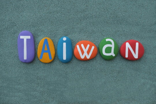 Taiwan, Republic of China, souvenir composed with hand painted multi colored stone letters over green sand