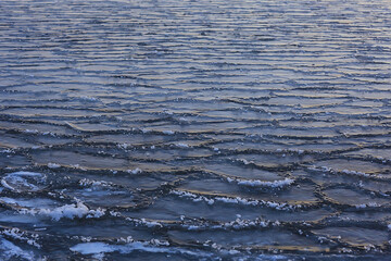 freezing sea ice round pieces, ocean background winter climate coast