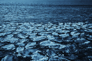 freezing sea ice round pieces, ocean background winter climate coast