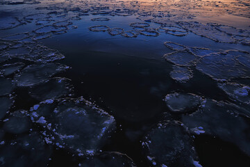 freezing sea ice round pieces, ocean background winter climate coast