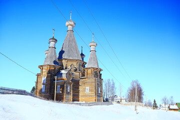 wooden church in the Russian north landscape in winter, architecture historical religion Christianity