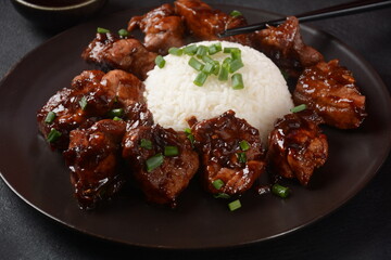 Homemade Filipino Adobo Pork with White Rice. Close-up shot of Filipino style adobo.