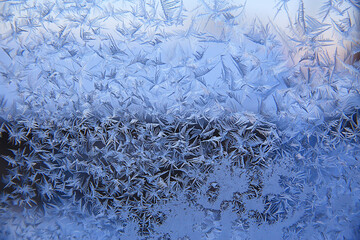 frost patterns on window glass, abstract background winter rime snow