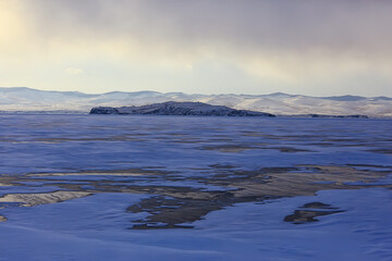 baikal ice landscape, winter season, transparent ice with cracks on the lake